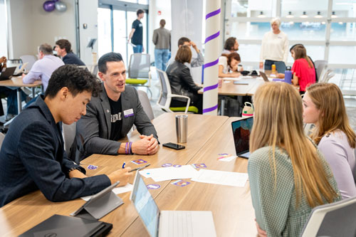 People Collaborating In Workspace